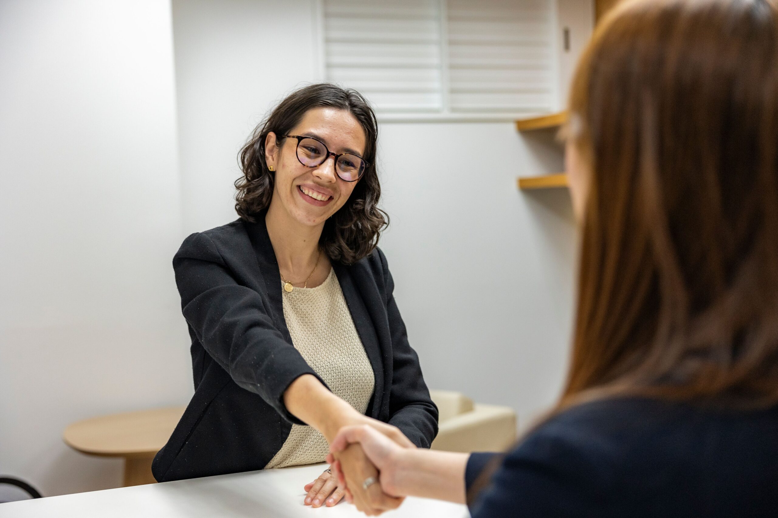 Financial advisor presenting precious metals pricing documents to a client