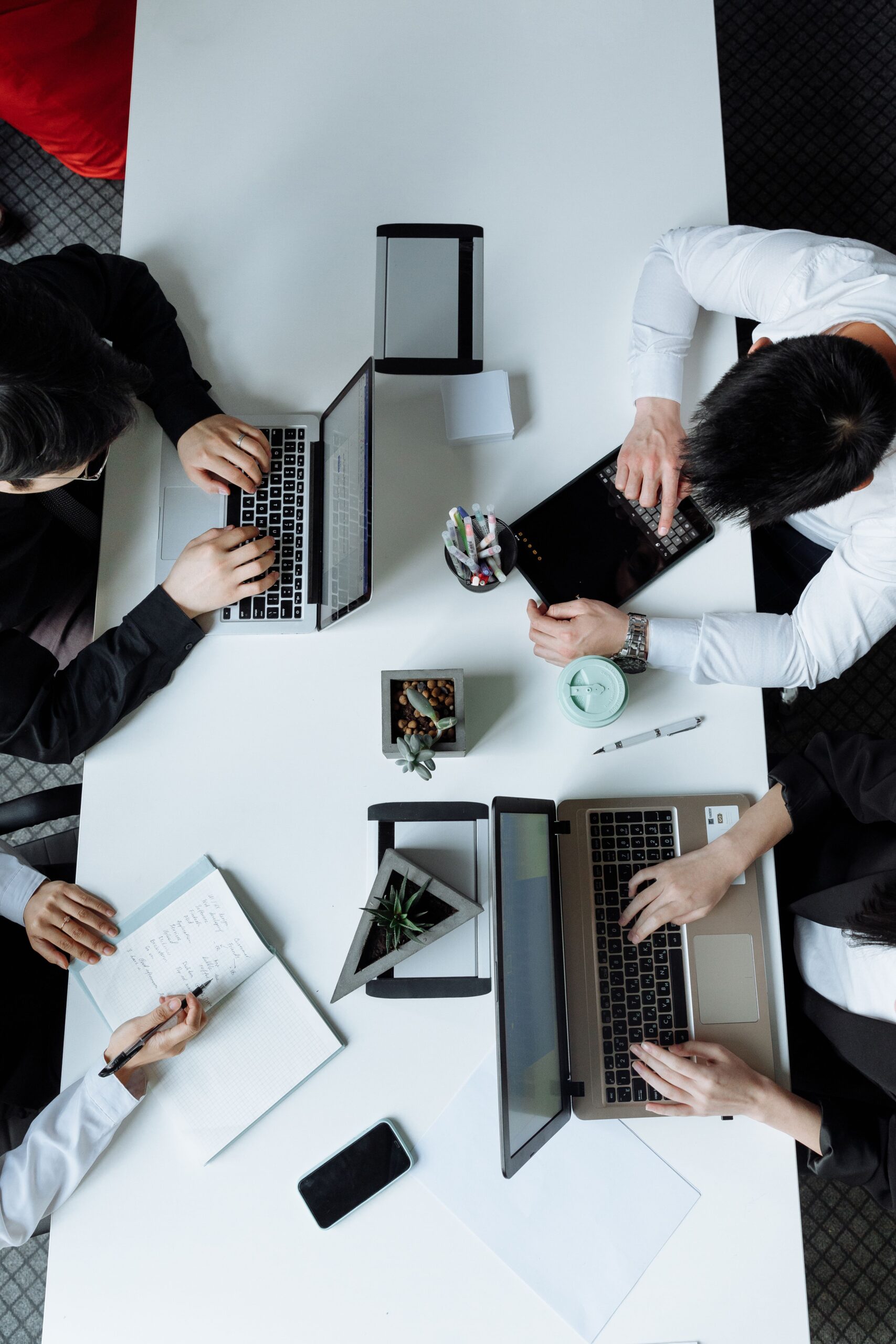 Operations and finance executives reviewing printed workflow documents