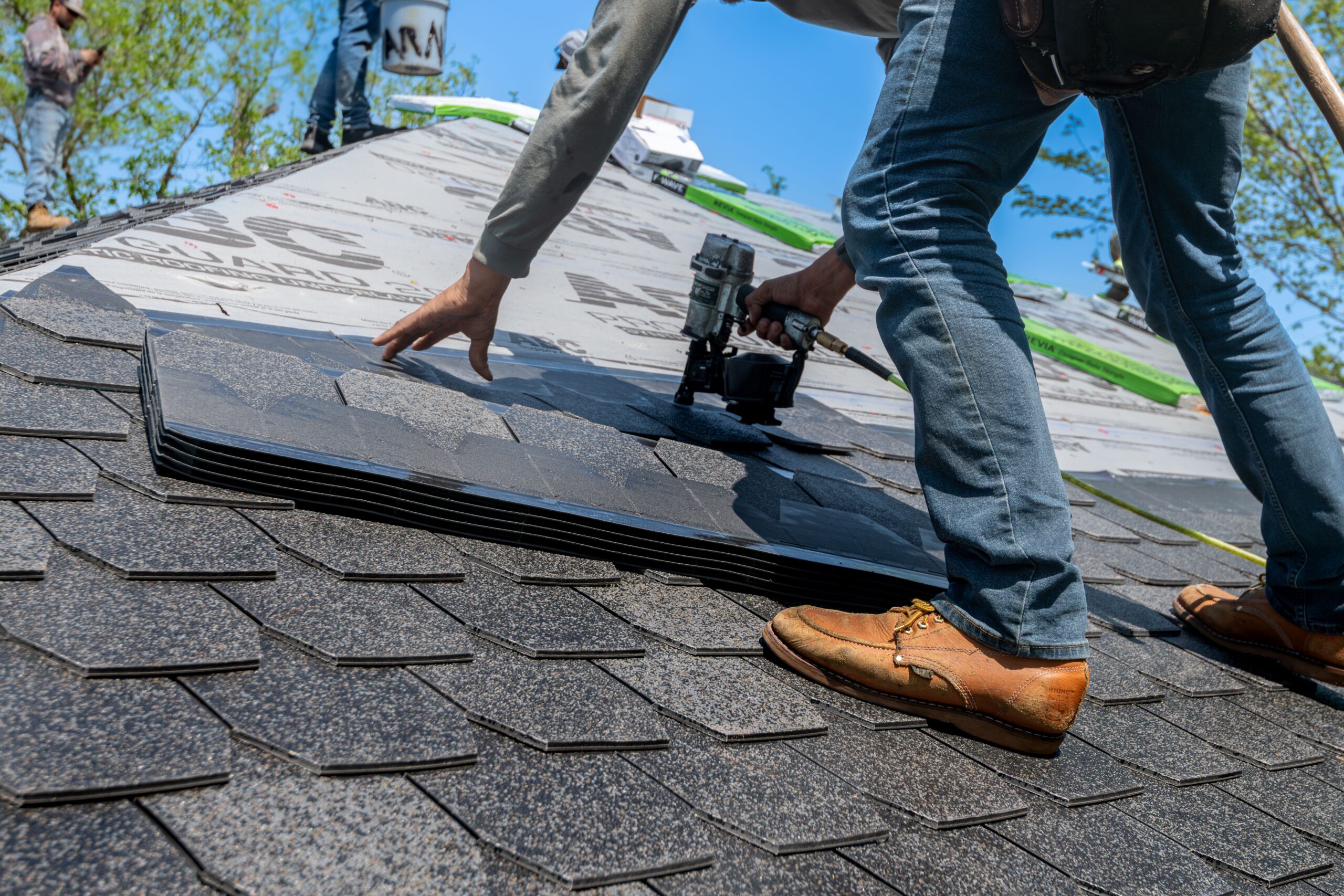 Roofing crew working on a commercial roof